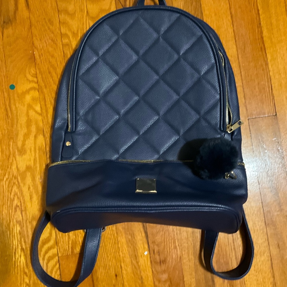 Staples like new Elegant Navy Front Quilted Gold Accented Backpack